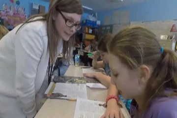 a fredonia student teaches children in a local classroom