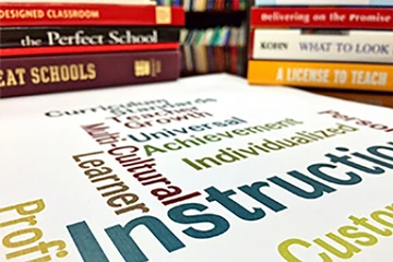 books on a table. If teaching physics is your dream, SUNY Fredonia is the perfect program for you.
