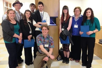 math students pose for a picture at a conference