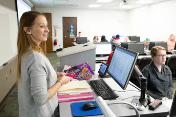 Mathematics professor Amber Powell outlines an exercise in a statistics class.