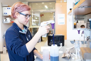 Student working in a lab. Fredonia molecular genetics degree students earn a versatile and sought-after degree. 