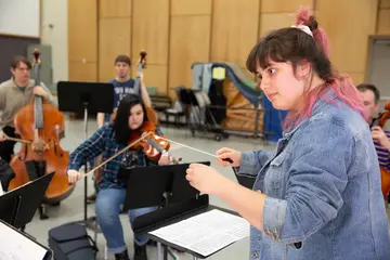 Future music teachers serve as both student and instructor in a small-group practice in Mason Hall.