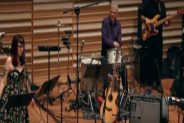 a student performs on the stage at Rosch Hall