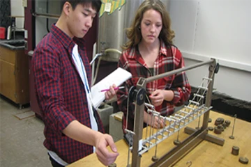 physics students work on a project