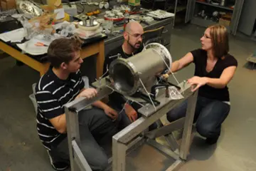 physics students work on a project