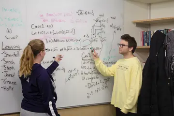 Fredonia math students at the whiteboard can earn a statistics minor