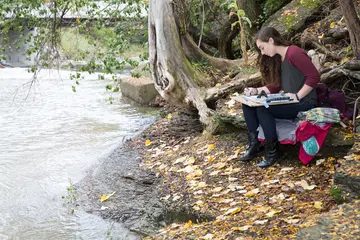 a student paints along the edge of local creek; drawing and painting degree; degree in drawing and painting; ba in drawing and painting, drawing and painting degree; degree in drawing and painting; ba in drawing and painting, drawing painting, drawing and painting major