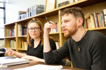 students engaged in a discussion in a classroom