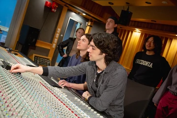 The School of Music Sound recording technology students work in the studio, earning a sound recording technology degree.  schools for sound engineering