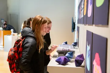 Fredonia students, like these women in an art gallery, can earn an Arts Administration (Minor)