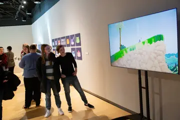 Fredonia students like these viewing a film in a gallery can earn a film studies minor