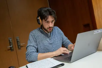 person writing on a computer, writing program, writing bachelors degree