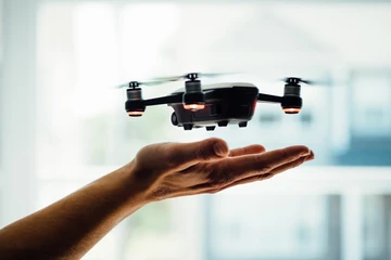 drone landing in a human hand