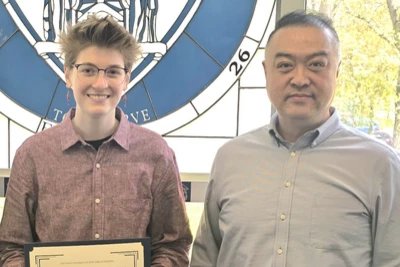 Digital photo of Honors student chosen with nominator.