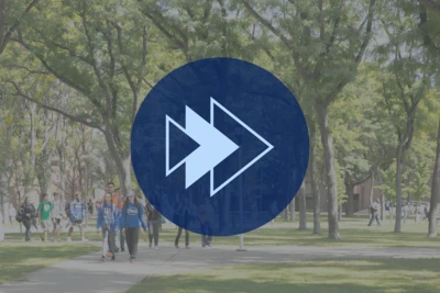 Students crossing campus through the Science Grove with an icon of arrows pointing forward.