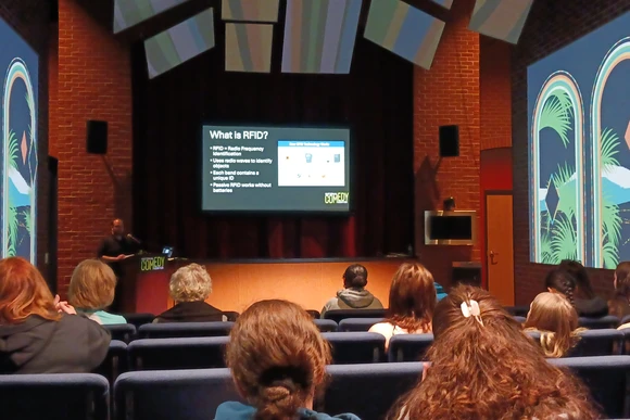 Students listen to a presentation about the technology that powers the National Comedy Center