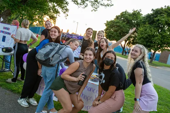 Fredonia students enjoying Activities Night on campus, meeting reps from new clubs, and making friends.