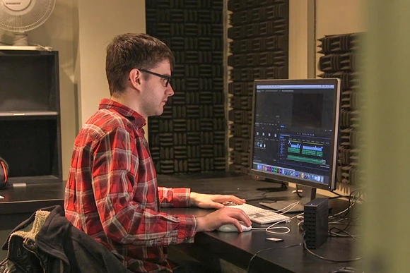 Fredonia student editing a video