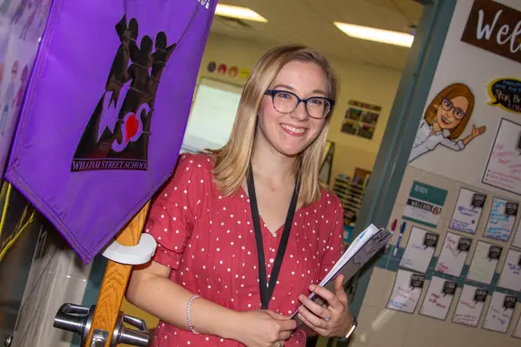 Fredonia education student on her way into a classroom. With 65+ programs to choose from Fredonia students can prepare themselves to make a difference with their careers.
