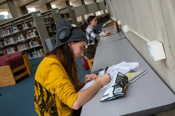Fredonia students studying quietly in the library 