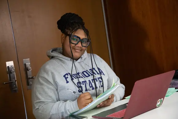 A student studying in the Williams Center.
