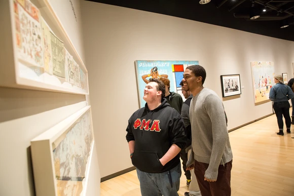 Students explore art during an opening at the Marion Art Gallery.