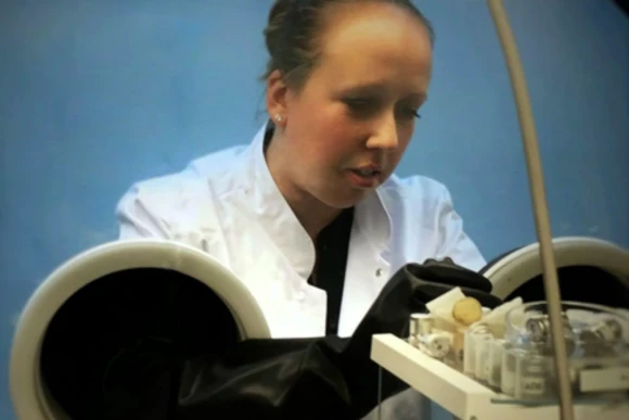 student performing experiment