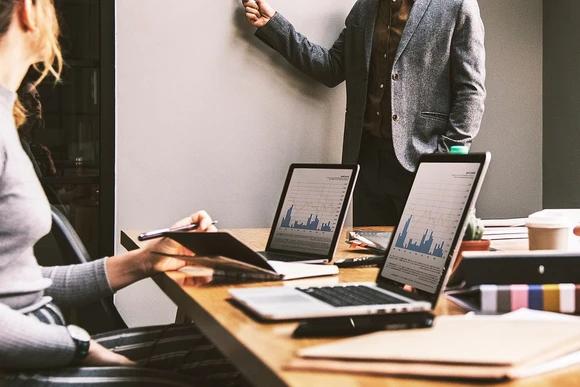 people in a meeting. writing degrees can take graduates anywhere