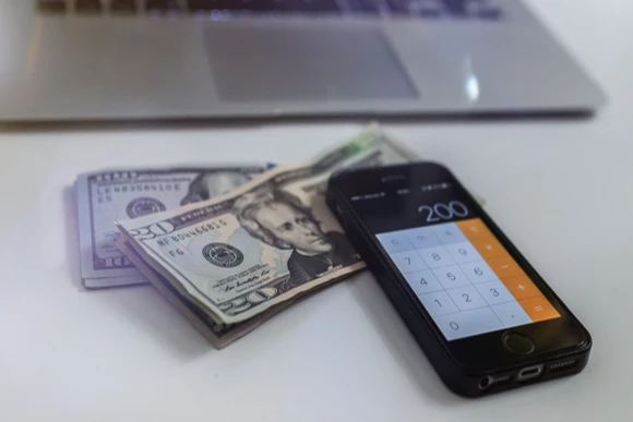 money, calculator and computer