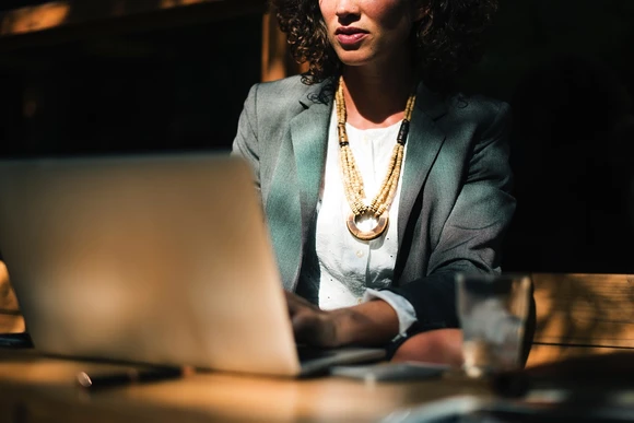 photo of person in front of laptop in an office. Fredonia students who earn a degree in mathematics can have a great career  with a mathematics degree. 
