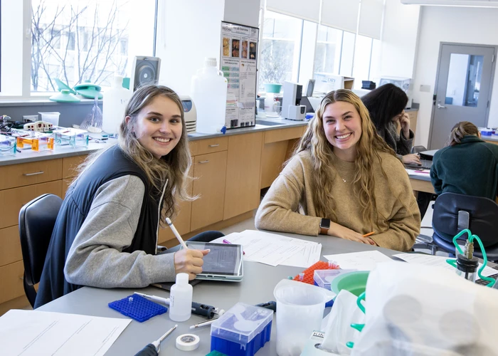 Fredonia students in a Biogenetics lab, working on a project