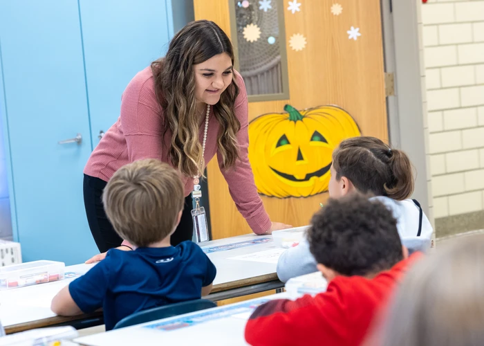 Fredonia student working with children while student teaching 