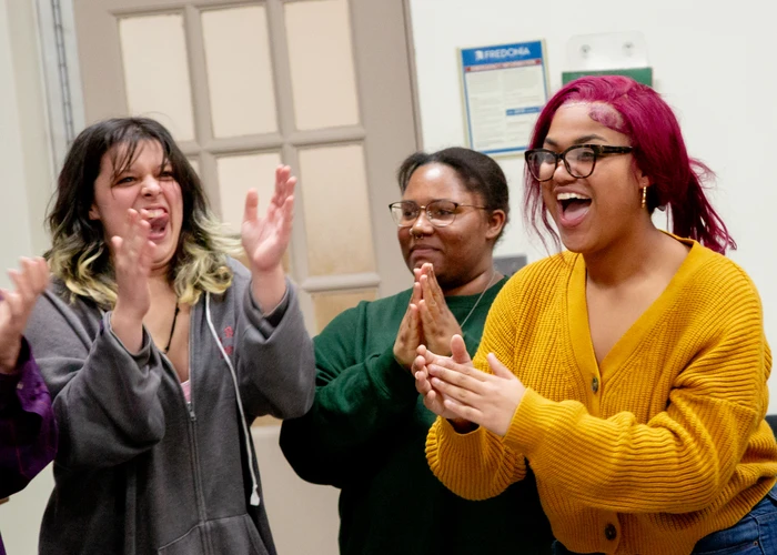 music therapy students clapping during an exercise. 