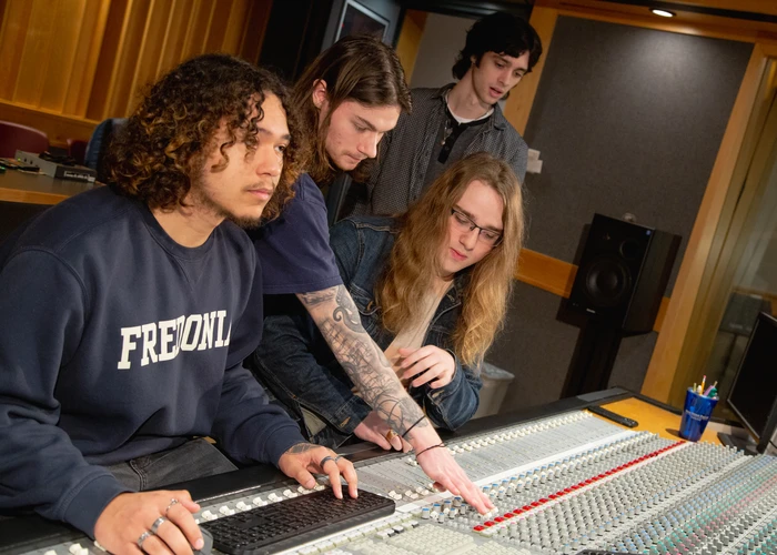 Fredonia students in the music studio mixing tracks for a senior project 