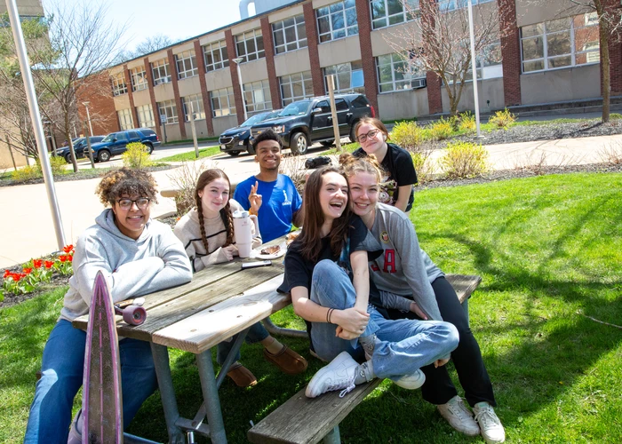 Students taking in the spring sunshine on campus