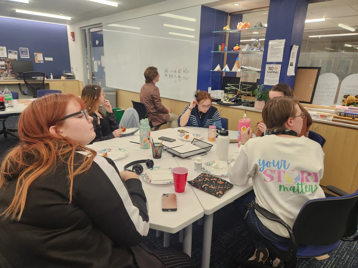 Students working on a problem together at a table