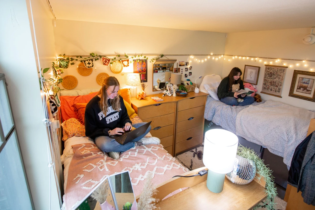 Grissom Hall bedroom featuring 2 students studying.
