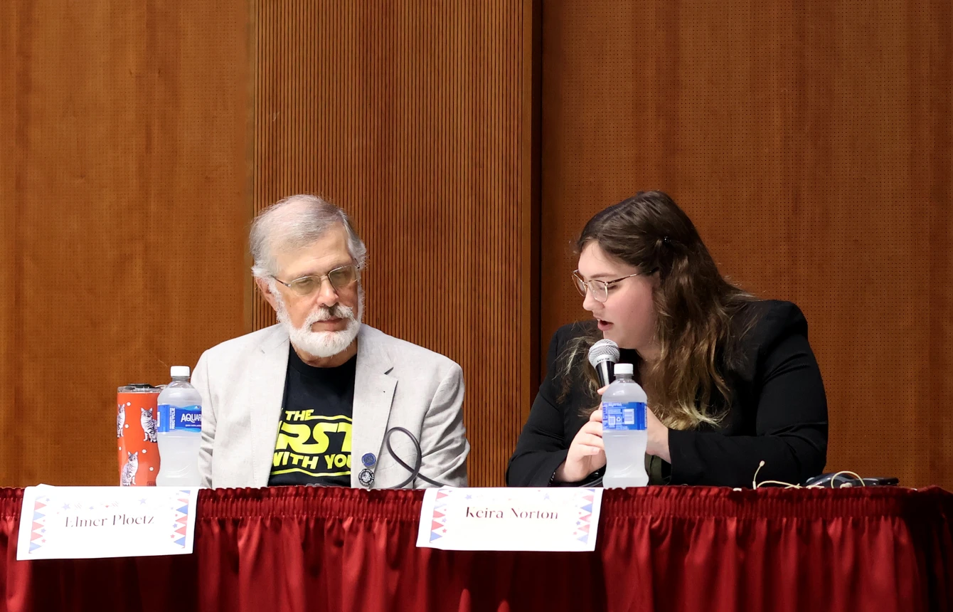 Moderators ask panelists questions about their role in a democracy.