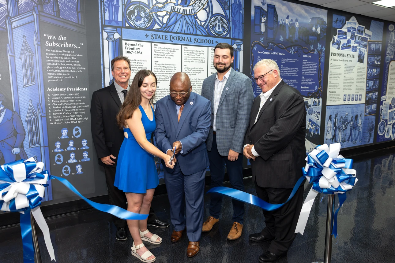 Ribbon-cutting ceremony for Bicentennial mural. Pictured are (l-r) Southern Chautauqua FCU CEO John Felton, artist Erin Ruffino ('19), Fredonia President Stephen H. Kolison, Jr., Southern Chautauqua FCU Chief Financial Officer Matthew Hoaglund (’21) 