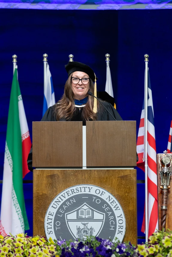 Fredonia Alumni Association Treasurer Dawn Spicer-Dake giving the Welcome to the Fredonia Alumni Association