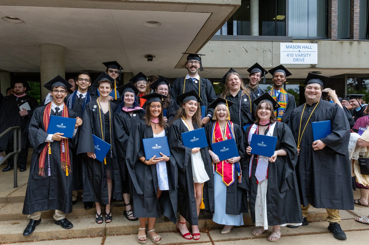 Graduates pose for a photo at the School of Music