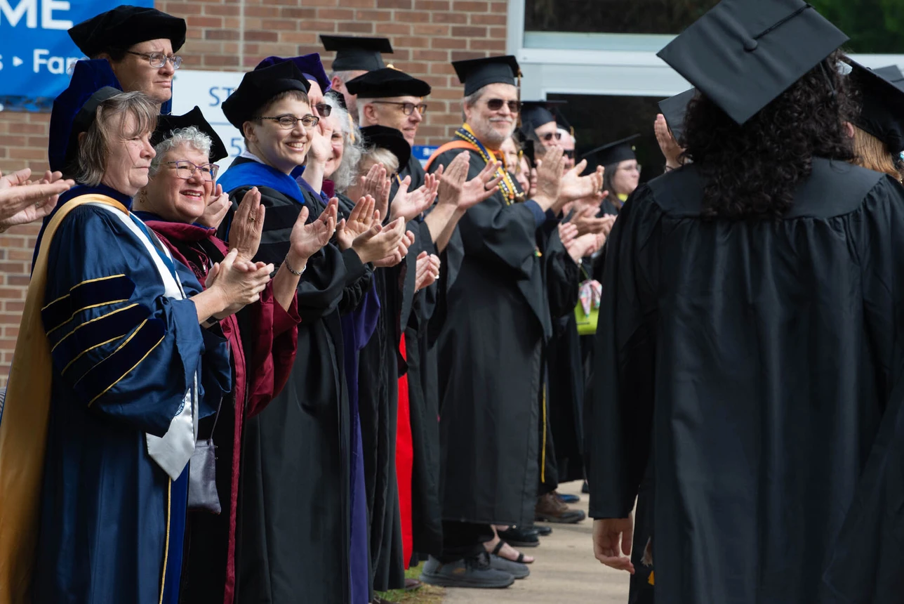 Faculty clapping for students