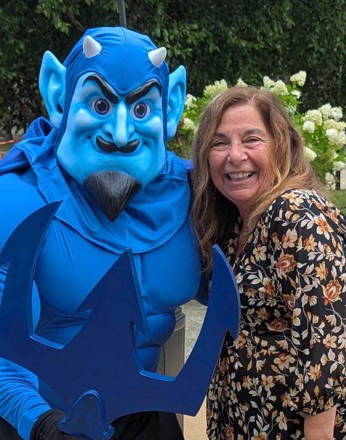 Freddy the mascot with woman 