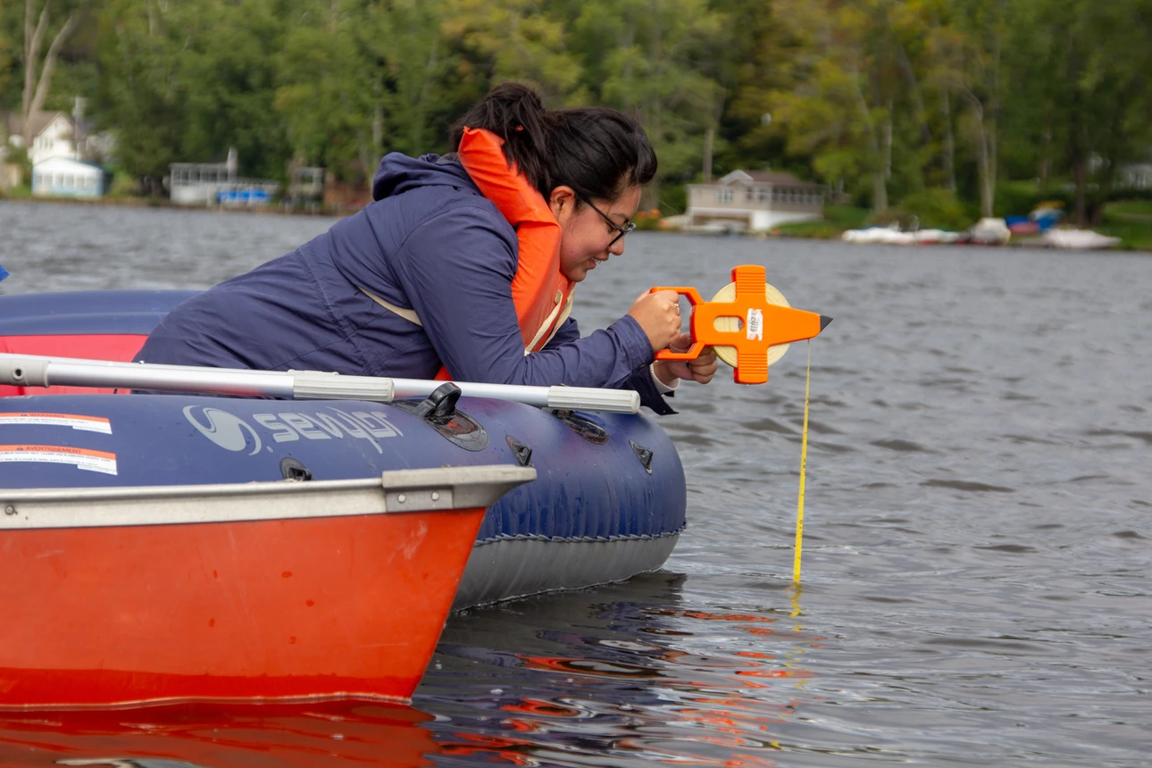 Students in Dr. Courtney Wigdahl-Perry's Aquatic Biology class collect water samples from Bear Lake.