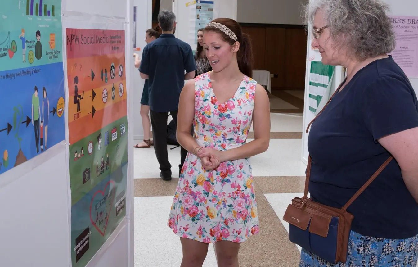 Student at past Expo poster presentation.