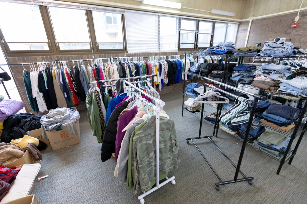 Full shot of room filled with clothing racks