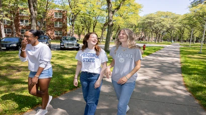 Fredonia students walking across campus. Fredonia's welcoming environment is perfect for transfer students, supporting them with making their transition to a new environment easier.  