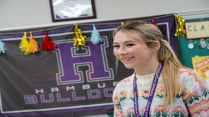 Fredonia student teacher in front of a classroom of students 