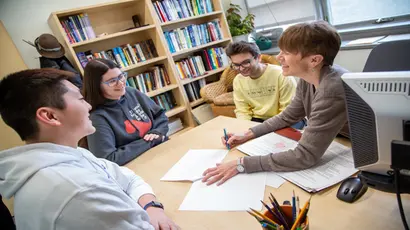 Fredonia students working with a math professor get individualized attention. Fredonia's low student-to-faculty ratio means students know their professors, classmates, and the campus community as a whole. 