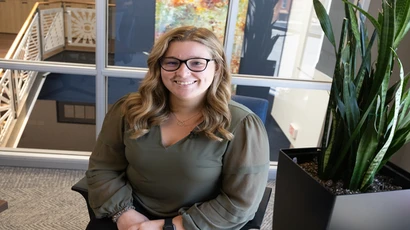 Accounting alum seated in an office